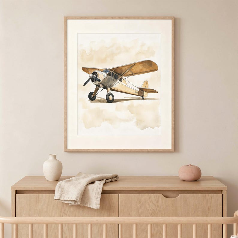 Vintage airplane nursery wall art — soft watercolor propeller plane above a crib